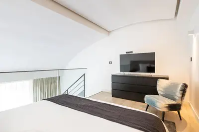 Un ou plusieurs lits dans un hébergement de l'établissement B2 Loft Duplex 175Blo-Paris Convention