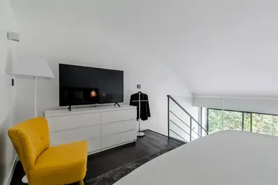 Télévision ou salle de divertissement dans l'établissement B5 Loft Duplex 175Blo-Paris Convention