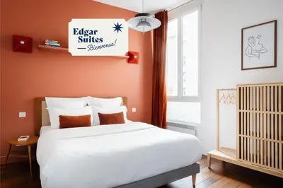 Un ou plusieurs lits dans un hébergement de l'établissement Edgar Suites Louvre - Saint-Honoré