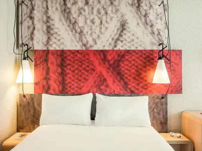 Un ou plusieurs lits dans un hébergement de l'établissement Ibis Paris Gare Montparnasse 15ème