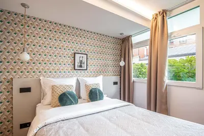 Un ou plusieurs lits dans un hébergement de l'établissement NEW - Superbe 1 Bdr Appt - Design 60'S - Paris 15e