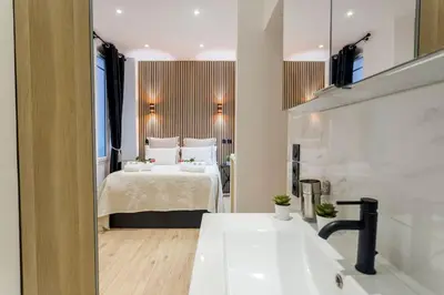 Un ou plusieurs lits dans un hébergement de l'établissement Suite Paris, Tour Eiffel, Champs Elysées