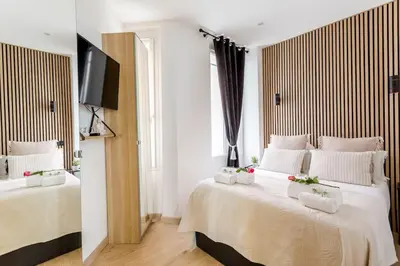 Un ou plusieurs lits dans un hébergement de l'établissement Suite Paris, Tour Eiffel, Champs Elysées