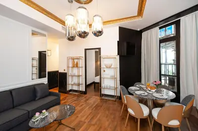 Coin salon dans l'établissement LE MARAIS PRESTIGE Luxueux - Cosy - Wifi
