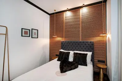 Un ou plusieurs lits dans un hébergement de l'établissement LE MARAIS PRESTIGE Luxueux - Cosy - Wifi