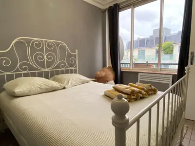 Un ou plusieurs lits dans un hébergement de l'établissement L'appartement des Champs Elysées