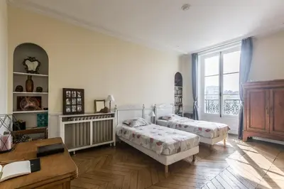 Un ou plusieurs lits dans un hébergement de l'établissement Paris-sur-seine-chez-caroline