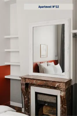 Un ou plusieurs lits dans un hébergement de l'établissement Edgar Suites Saint-Lazare - Amsterdam