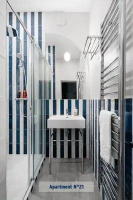 Télévision ou salle de divertissement dans l'établissement Edgar Suites Saint-Lazare - Amsterdam