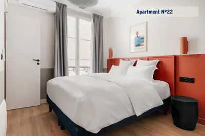 Un ou plusieurs lits dans un hébergement de l'établissement Edgar Suites Saint-Lazare - Amsterdam