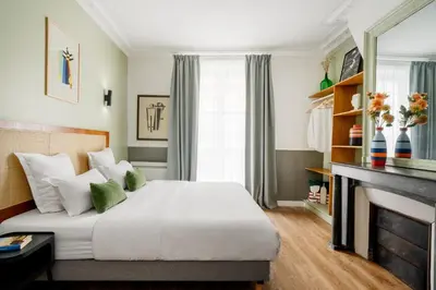 Un ou plusieurs lits dans un hébergement de l'établissement Edgar Suites Grands Boulevards - Hauteville