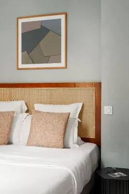 Un ou plusieurs lits dans un hébergement de l'établissement Edgar Suites Grands Boulevards - Hauteville