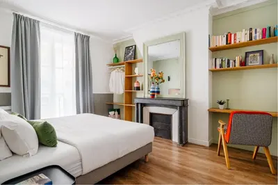 Un ou plusieurs lits dans un hébergement de l'établissement Edgar Suites Grands Boulevards - Hauteville