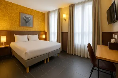 Un ou plusieurs lits dans un hébergement de l'établissement Walled off Hotel Paris