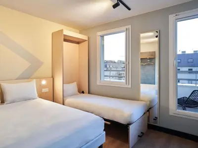Un ou plusieurs lits dans un hébergement de l'établissement ibis budget Issy Les Moulineaux Paris Ouest