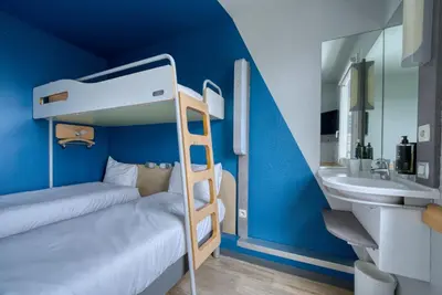 Un ou plusieurs lits dans un hébergement de l'établissement ibis Budget Gennevilliers Asnières - Rénové en 2025
