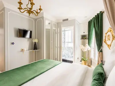 Un ou plusieurs lits dans un hébergement de l'établissement Merveil - Luxury Suite -Champs Elysees-Ponthieu II