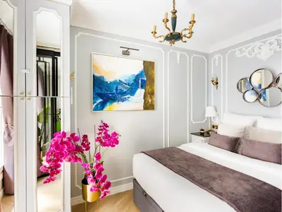 Un ou plusieurs lits dans un hébergement de l'établissement Merveil - Luxury Suite -Champs Elysees-Ponthieu II