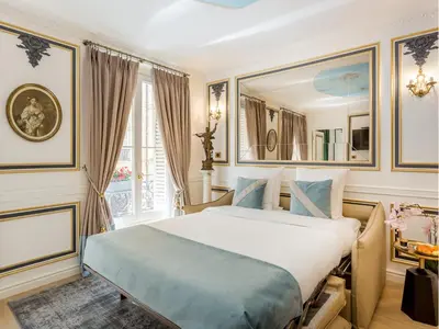 Un ou plusieurs lits dans un hébergement de l'établissement Merveil - Luxury Suite -Champs Elysees- Ponthieu I