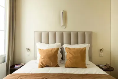 Un ou plusieurs lits dans un hébergement de l'établissement Spacious apartment - 3BR-8P - Moulin Rouge