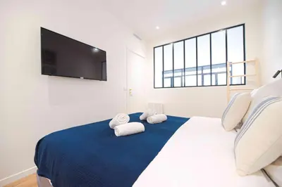 Un ou plusieurs lits dans un hébergement de l'établissement Luxury Residence - Paris South