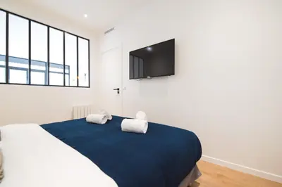 Télévision ou salle de divertissement dans l'établissement Luxury Residence - Paris South