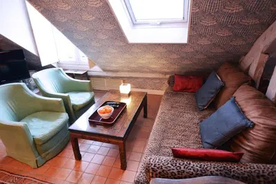 Coin salon dans l'établissement Charming Studio Near Louvre
