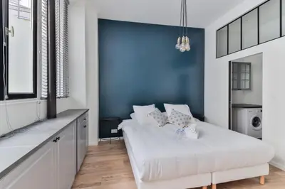 Un ou plusieurs lits dans un hébergement de l'établissement Luxury home in heart of PARIS!Opera/Eurostar 6pers