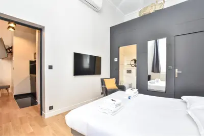 Un ou plusieurs lits dans un hébergement de l'établissement Cosy apartment - 2BR-7P - Arc de Triomphe