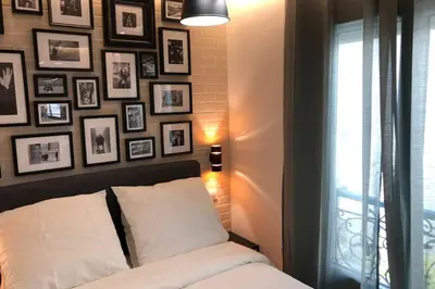 Un ou plusieurs lits dans un hébergement de l'établissement Appartement Rousselet Quartier Bon Marché Paris VIIème