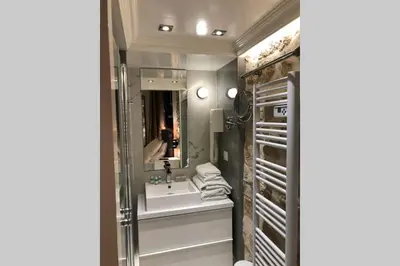 Un ou plusieurs lits dans un hébergement de l'établissement Loft Nazareth Quartier du Marais
