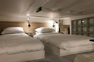 Un ou plusieurs lits dans un hébergement de l'établissement Loft Nazareth Quartier du Marais