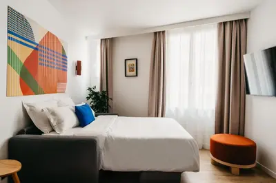 Un ou plusieurs lits dans un hébergement de l'établissement Edgar Suites Auteuil - Le Marois