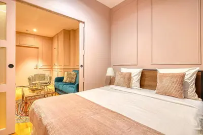 Un ou plusieurs lits dans un hébergement de l'établissement Suite Anna In Paris Republique