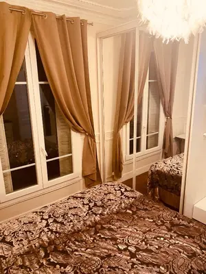 Un ou plusieurs lits dans un hébergement de l'établissement Paris parc Buttes-Chaumont