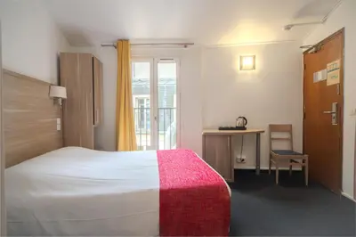 Un ou plusieurs lits dans un hébergement de l'établissement City Inn Paris