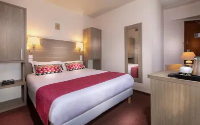 Un ou plusieurs lits dans un hébergement de l'établissement City Inn Paris