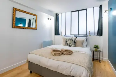 Un ou plusieurs lits dans un hébergement de l'établissement Prestigious House - 3 rooms - Montparnasse & St Germain
