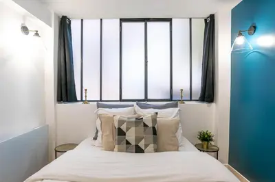 Un ou plusieurs lits dans un hébergement de l'établissement Prestigious House - 3 rooms - Montparnasse & St Germain
