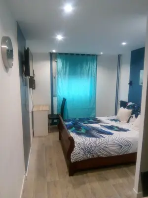 Un ou plusieurs lits dans un hébergement de l'établissement Studio 28m² au pied de la défense