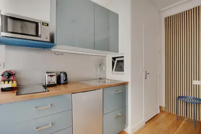 Cuisine ou kitchenette dans l'établissement A Sweet Studio in Montparnasse - Boulevard du Montparnasse