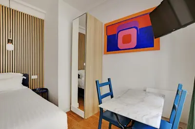 Un ou plusieurs lits dans un hébergement de l'établissement A Sweet Studio in Montparnasse - Boulevard du Montparnasse