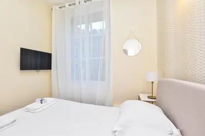 Un ou plusieurs lits dans un hébergement de l'établissement Cosy apartment - Buttes aux Cailles