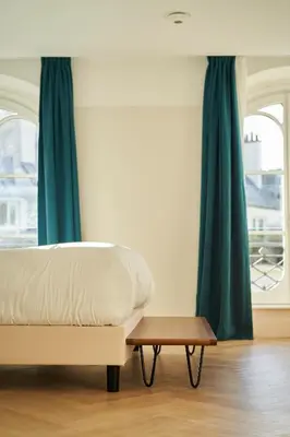 Un ou plusieurs lits dans un hébergement de l'établissement Hôtel du Sentier