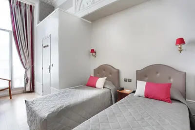 Un ou plusieurs lits dans un hébergement de l'établissement Hotel Montpensier