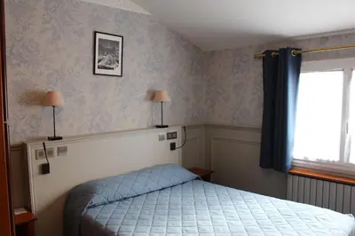 Un ou plusieurs lits dans un hébergement de l'établissement Hotel Montpensier