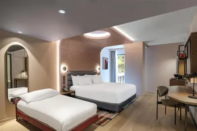 Un ou plusieurs lits dans un hébergement de l'établissement Canopy By Hilton Paris Eiffel Tower