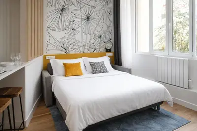 Un ou plusieurs lits dans un hébergement de l'établissement Cosy Loft near Montmartre