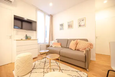 Coin salon dans l'établissement Cosy home in Paris Center - With AC