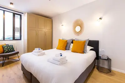 Un ou plusieurs lits dans un hébergement de l'établissement Charming apartment - 2BR-6P - Grands Boulevards